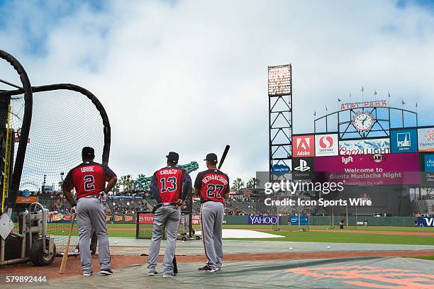 Atlanta Braves third baseman Juan Uribe , Atlanta Braves left fielder Dian Toscano and Atlanta Braves catcher Christian Bethancourt await their...