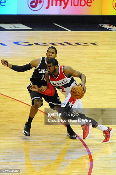 Washington Wizards guard John Wall drives to the basket against Brooklyn Nets guard Darius Morris at the Verizon Center in Washington, D.C. Where the...