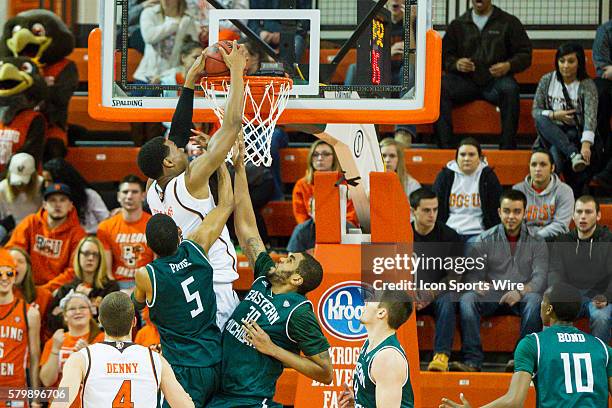 Bowling Green Falcons forward Richaun Holmes dunks the ball over Eastern Michigan Eagles center Mike Samuels and Eastern Michigan Eagles guard Jodan...