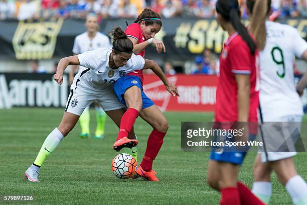 Costa Rica Forward Carolina Venegas tries to steal the ball from United States Midfielder Carli Lloyd during the game between Costa Rica and the...