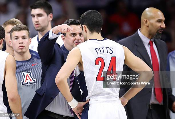 Arizona Wildcats head coach Sean Miller talks with guard Elliott Pitts during the first half of the Pac-12 College Basketball Game between the Oregon...