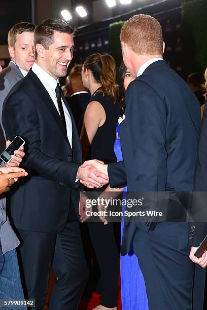 Green Bay Packer Quarterback Aaron Rodgers says hello to Dallas Cowboys head coach Jason Garrett on the Red Carpet for the 4th Annual NFL Honors held...