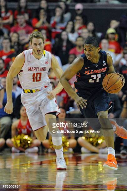 Illinois Fighting Illini guard Malcolm Hill takes at the ball from Maryland Terrapins forward Jake Layman in action against xx at the Xfinity Center...