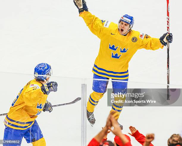 Sebastian Aho and Lucas Wallmark of Sweden celebrates a goal during Russia's 4-1 victory over Sweden at the IIHF World Junior Championship at Air...