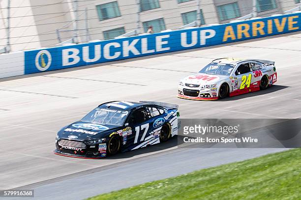 Ricky Stenhouse Jr., NASCAR Sprint Cup Series driver of the Ford EcoBoost Ford and Jeff Gordon in the 3M Chevrolet during the FedEx 400 Benefiting...