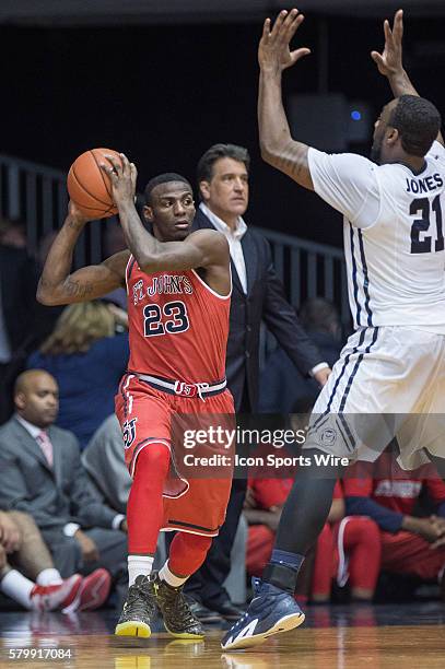 St. John's Red Storm guard Rysheed Jordan looks to pass as Butler Bulldogs forward Roosevelt Jones defends during the NCAA basketball game between...