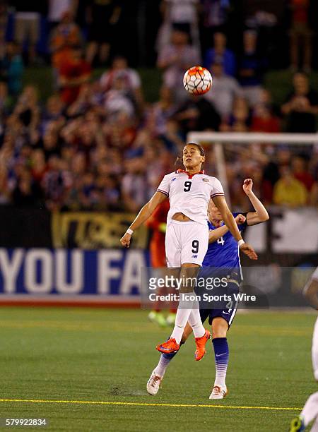 Costa Rica forward Carolina Venegas heads the ball as United States of America defender Becky Sauerbrunn defends on the play. United States of...