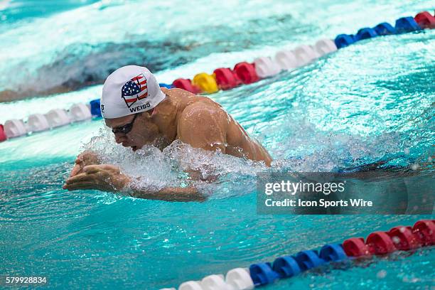 Michael Weiss competes in the 100m breaststroke preliminary during the Arena Pro Swim Series at the YMCA Aquatic Center in Orlando, FL.