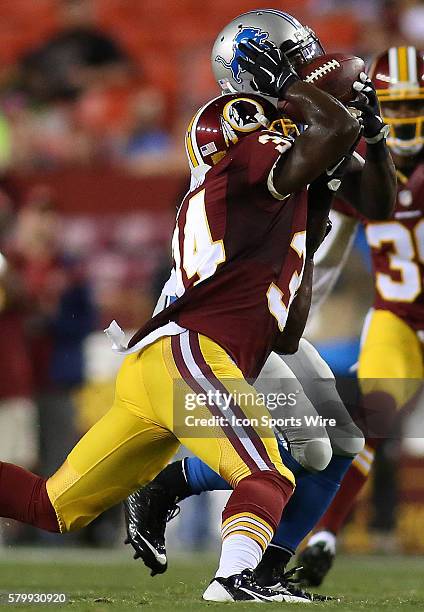 Detroit Lions wide receiver Jeremy Ross hauls in an amazing one handed catch against Washington Redskins safety Trenton Robinson during a match...