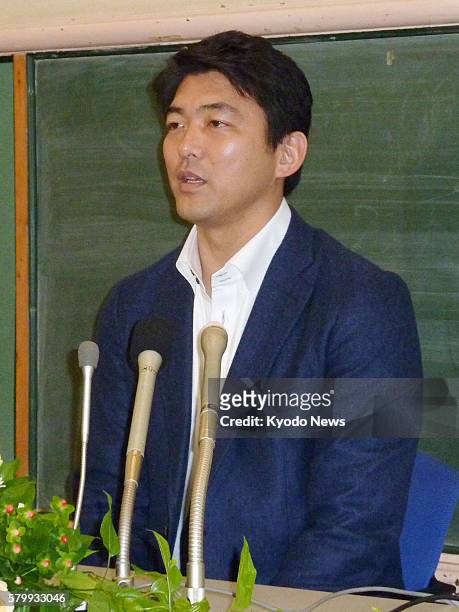 Japan - Japanese pitcher Takashi Saito speaks at a press conference in Tokyo on Dec. 15 after Major League Baseball's Arizona Diamondbacks said they...