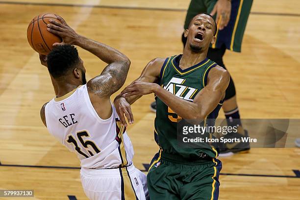 New Orleans Pelicans forward Alonzo Gee fouls Utah Jazz guard Rodney Hood during the NBA game between the Utah Jazz and the New Orleans Pelicans at...