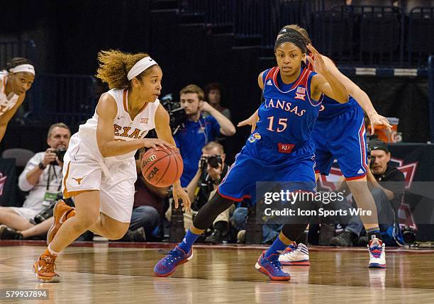 Texas Celina Rodrigo dribbles to make a play while Kansas Aisia Roberts plays defense during the Big 12 Women's Championship at the Chesapeake Energy...