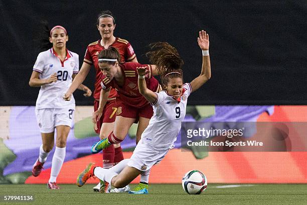Spain forward Vicky Losada pushes Costa Rica forward Carolina Venegas during the 2015 FIFA Women's World Cup Group E match between Spain and Costa...