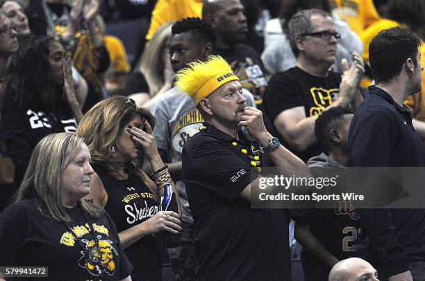 Glum Wichita State fans watch in the final seconds during a Missouri Valley Conference Championship basketball game between the Wichita State...