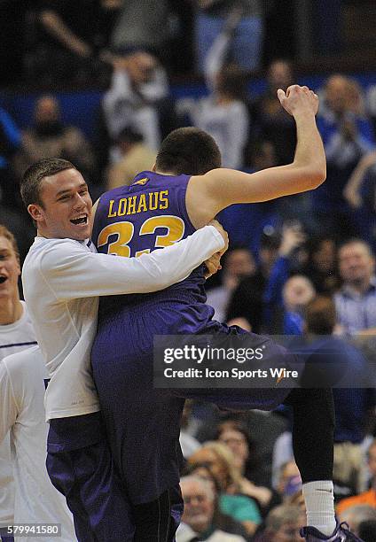 Northern Iowa guard Wyatt Lohaus gets a big hug after upsetting Wichita State after a Missouri Valley Conference Championship basketball game between...