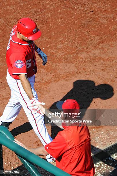 Washington Nationals third baseman Anthony Rendon is congratulated by manager Matt Williams after his three run home run against the Milwaukee...