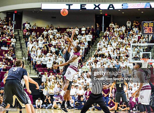 Texas A&M Aggies guard Jalen Jones wins the opening tip over Vanderbilt Commodores center Damian Jones during the Vanderbilt Commodores vs Texas A&M...