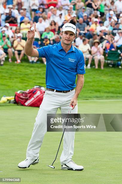 Kevin Streelman acknowledges the gallery surrounding the 18th green at the conclusion of his round during the final round of the Memorial Tournament...