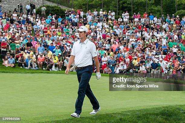 Justin Rose walks onto the 18th green during the first sudden-death playoff hole during the final round of the Memorial Tournament presented by...