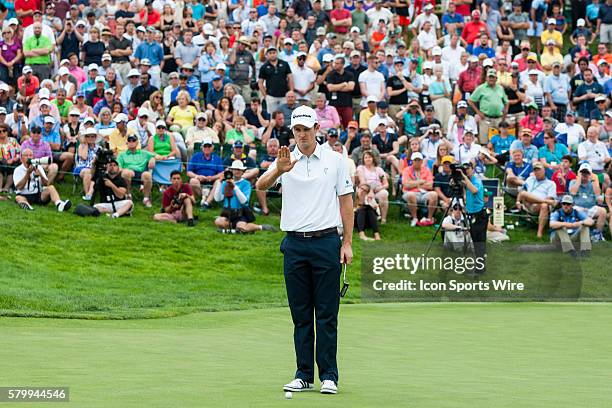 Justin Rose lines up his put on the first sudden-death playoff hole during the final round of the Memorial Tournament presented by Nationwide...
