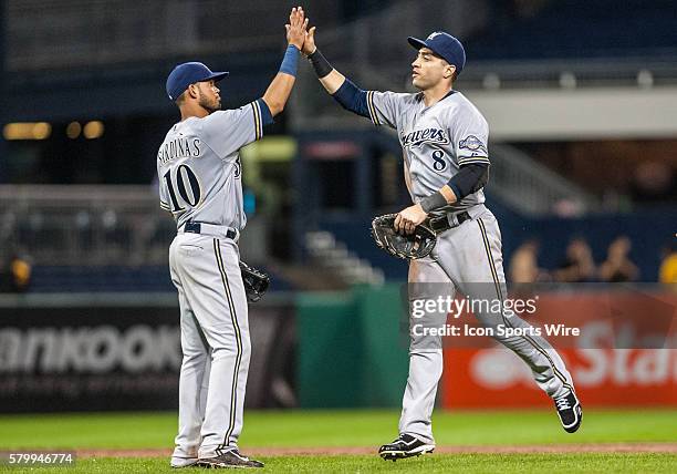 Milwaukee Brewers right fielder Ryan Braun high fives shortstop Luis Sardinas after the final out in the Milwaukee Brewers 2-0 win over the...