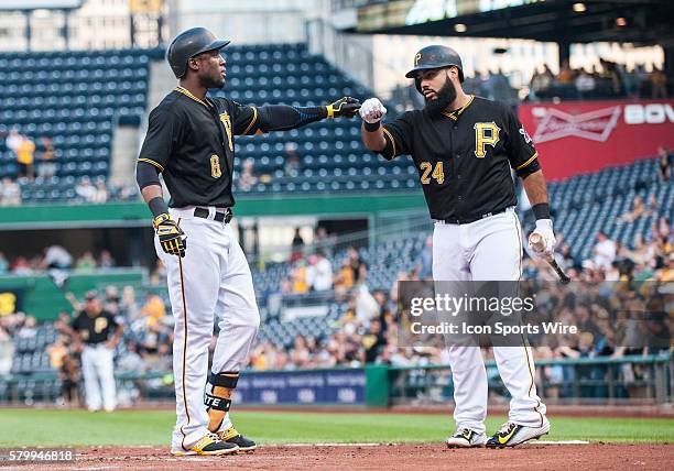 Pittsburgh Pirates left fielder Starling Marte is greeted by first baseman Pedro Alvarez after hitting a solo home run during the second inning in...