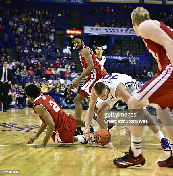 Northern Iowa forward Seth Tuttle picks up a loose ball during a second round Missouri Valley Conference Basketball Tournament game between the...