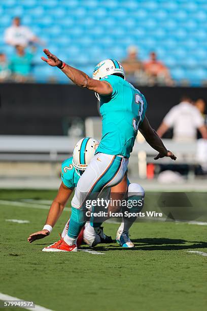 Miami Dolphins kicker Andrew Franks makes a kick during the pre-season game between the Carolina Panthers and the Miami Dolphins at Bank of America...
