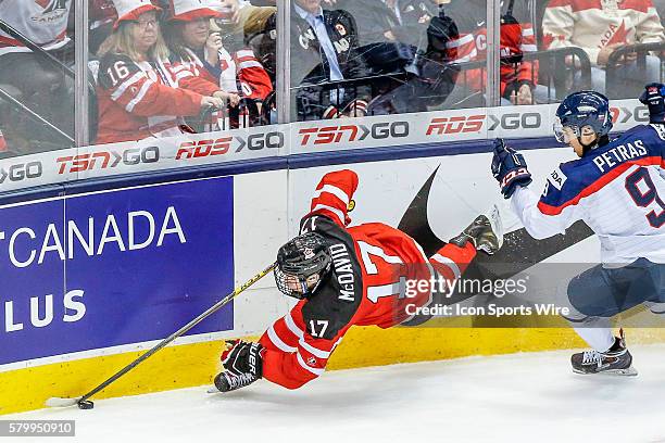 Connor McDavid of Team Canada falls while stick handling against Samuel Petras of Slovakia during Canada's 5-1 victory over Slovakia at the IIHF...