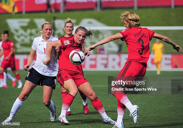 June 11, 2015 - Ottawa, Ontario, Canada Defender Saskia Bertusiak of Germany clears the ball as Tabea Kemme holds off Kristine Minde of Norway during...