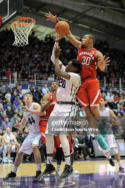 Northwestern Wildcats center Alex Olah goes up for a shot while Nebraska Cornhuskers forward Ed Morrow defends during a game between the Nebraska...