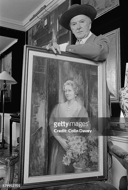 English fashion photographer Cecil Beaton with one of his paintings, UK, circa 1972.