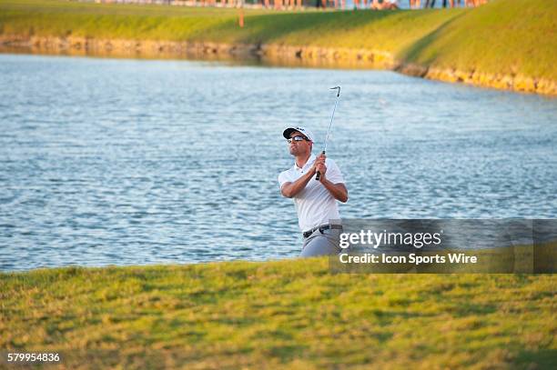 Adam Scott of Australia swings his third stroke on the 18th hole and wins the World Golf Championships-Cadillac Championship at Trump National Doral...