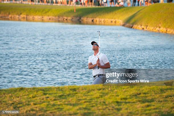 Adam Scott of Australia swings his third stroke on the 18th hole and wins the World Golf Championships-Cadillac Championship at Trump National Doral...