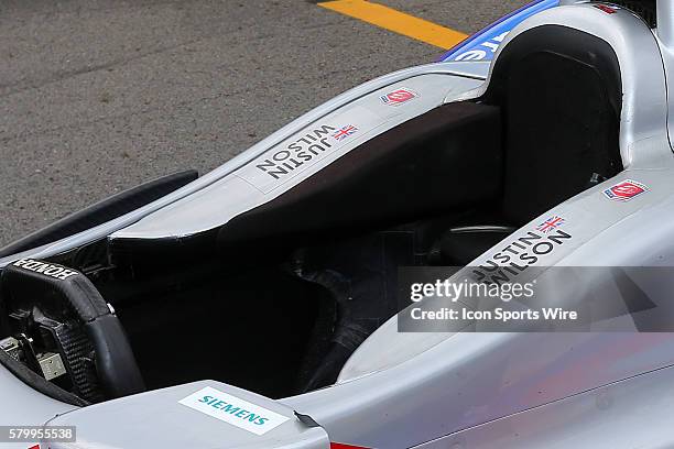 Justin Wilson driver of the Andretti Autosports Honda sits empty on the grid prior to the Verizon IndyCar Series ABC Supply 500 at Pocono Raceway in...