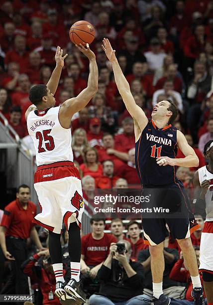 Louisville Cardinals guard/forward Wayne Blackshear shoots over Virginia Cavaliers forward Evan Nolte in a game between the University of Virginia...