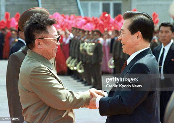 Pyongyang, North Korea - Photo taken in June 2000 shows North Korean leader Kim Jong Il and then South Korean President Kim Dae Jung shaking hands at...