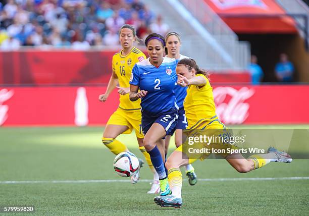 June 2015 USA's Sydney Leroux is checked by Australia's Melissa Barbieri during the USA vs Sweden game at the Investors Group Field in Winnipeg MB.