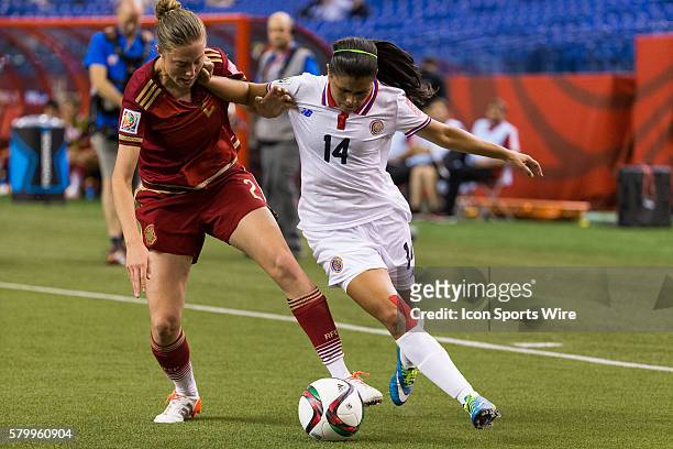 Spain defender Celia Jimenez and Costa Rica forward Maria Barrantes fight for the ball during the 2015 FIFA Women's World Cup Group E match between...