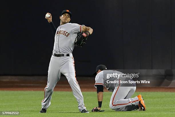 San Francisco Giants right fielder Justin Maxwell throws the ball in after making the catch during the fifth inning of the game between the New York...