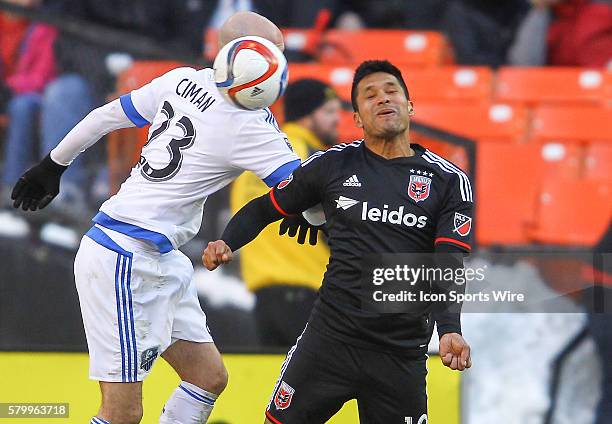 Jairo Arrieta of D.C United challenges for a loose ball with Laurent Ciman of Montreal Impact during a MLS soccer match at RFK Stadium, in Washington...