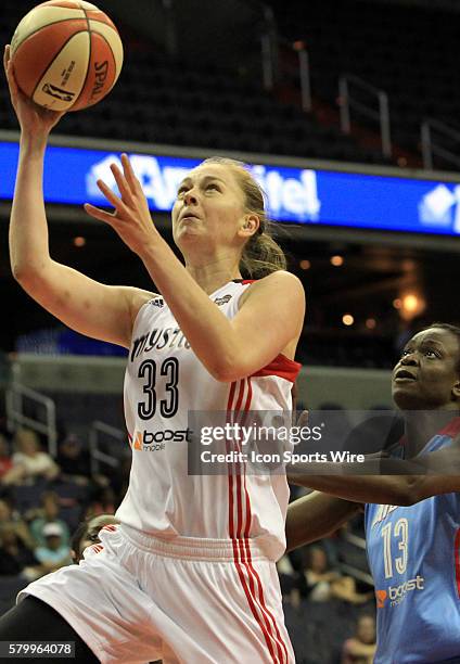 Emma Meesseman of the Washington Mystics shoots over Aneika Henry of Atlanta during a WNBA game at Verizon Center, in Washington D.C. Dream won 64-61