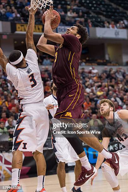 Minnesota Golden Gophers forward Jordan Murphy drives in against Illinois Fighting Illini guard Khalid Lewis during the men's Big Ten Tournament...