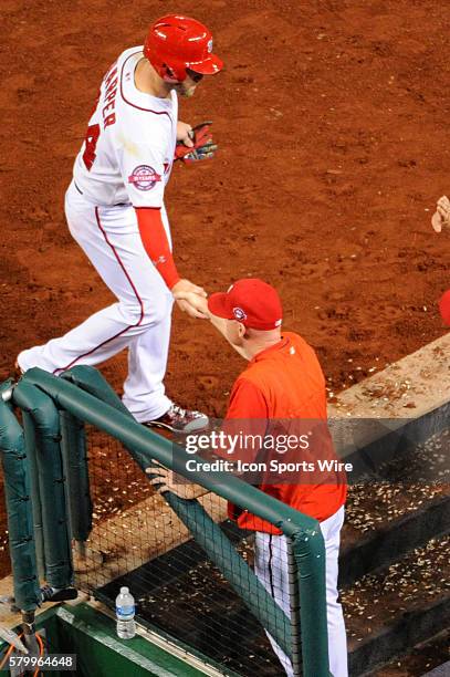 Washington Nationals right fielder Bryce Harper is congratulated by manager Matt Williams against the San Diego Padres at Nationals Park in...