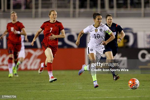 United States midfielder Carli Lloyd breaks away from Germany during the first half at FAU Stadium in Boca Raton, Florida.