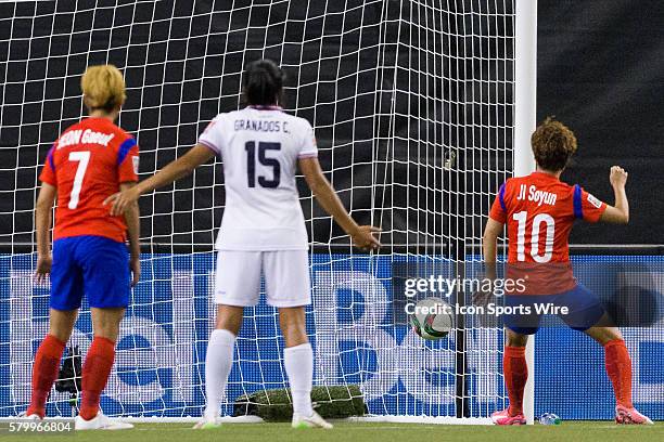 Korea forward Ji Soyun scores a goal against Costa Rica goalkeeper Dinnia Diaz during the 2015 FIFA Women's World Cup Group E match between Korea and...