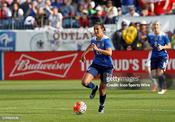 Midfielder Carli Lloyd breaks away from the pack and races towards the goal. The United States defeated France 1-0 in the SheBelieves Cup held at...