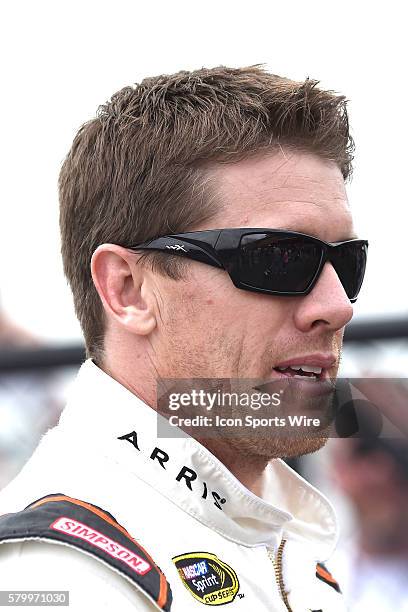 Carl Edwards heading to driver introductions for the Quicken Loans 400 NASCAR Sprint Cup Series race at Michigan International Speedway in Brooklyn,...