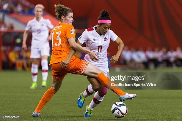 Netherlands defender Dominique Janssen blocks Canada midfielder Desiree Scott during the 2015 FIFA Women's World Cup Group A match between...