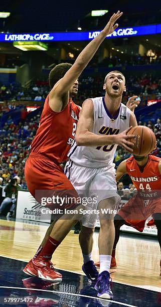 Northern Iowa forward Seth Tuttle gets ready to shoot over Illinois State center Reggie Lynch during the championship game of the Missouri Valley...